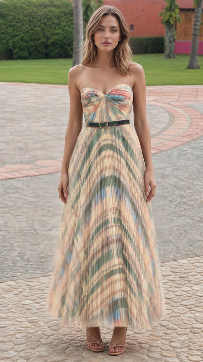 Model wearing beige patterned pleated strapless maxi dress