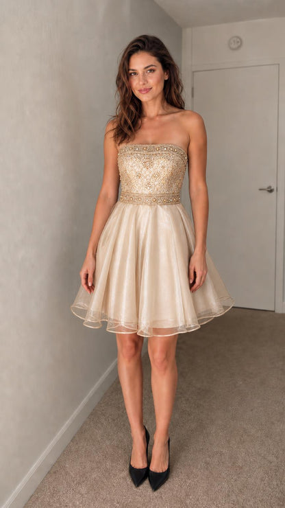Front view of champagne strapless embroidered cocktail dress
