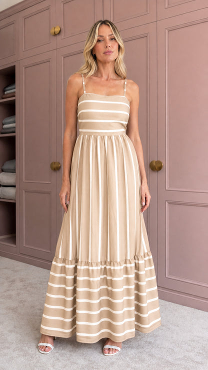 Woman wearing khaki striped tiered maxi dress